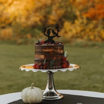 Autumn-toned cake on a pedestal stand